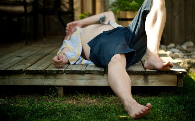 man sleeping on deck