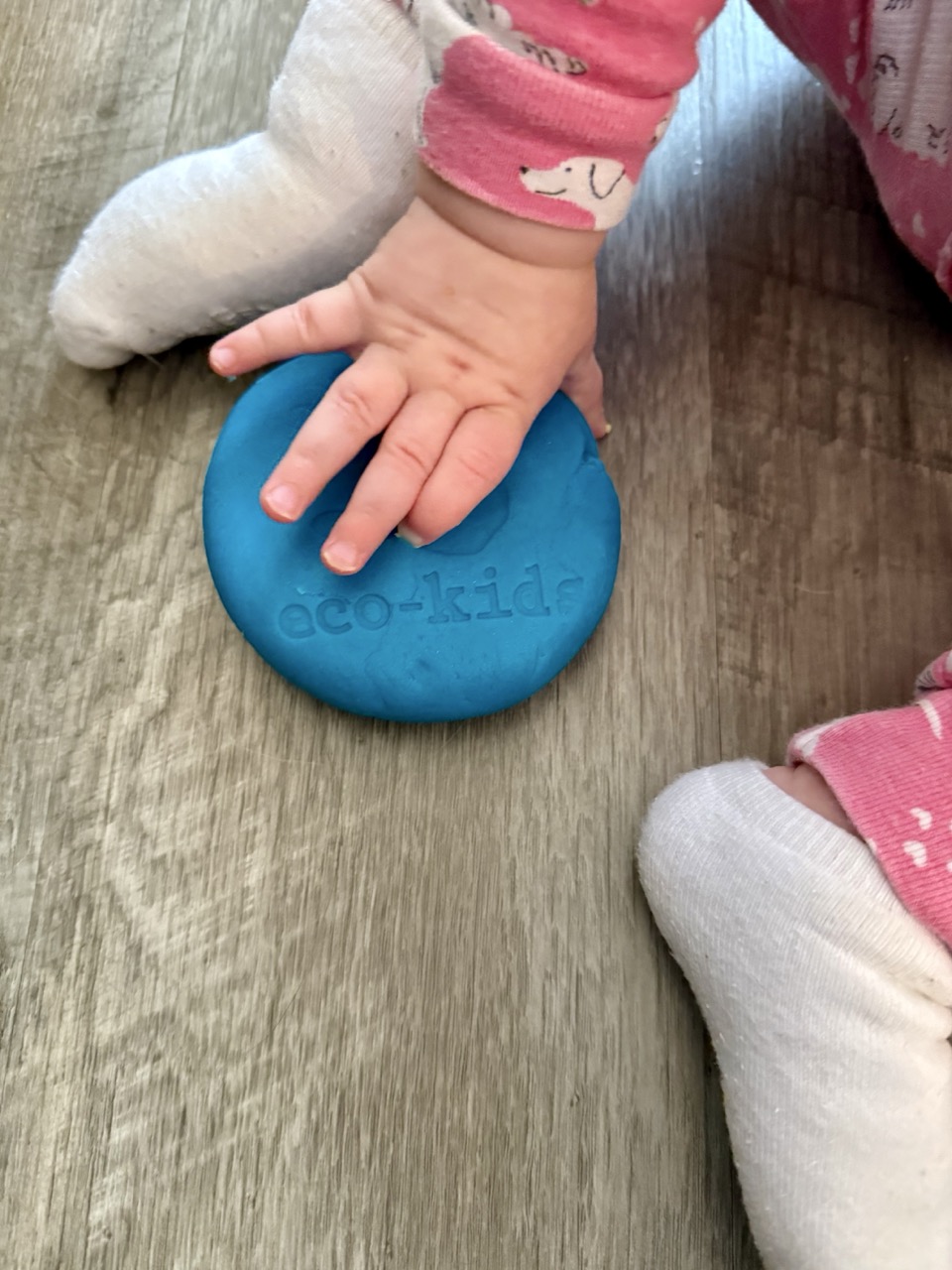 baby playing with eco dough