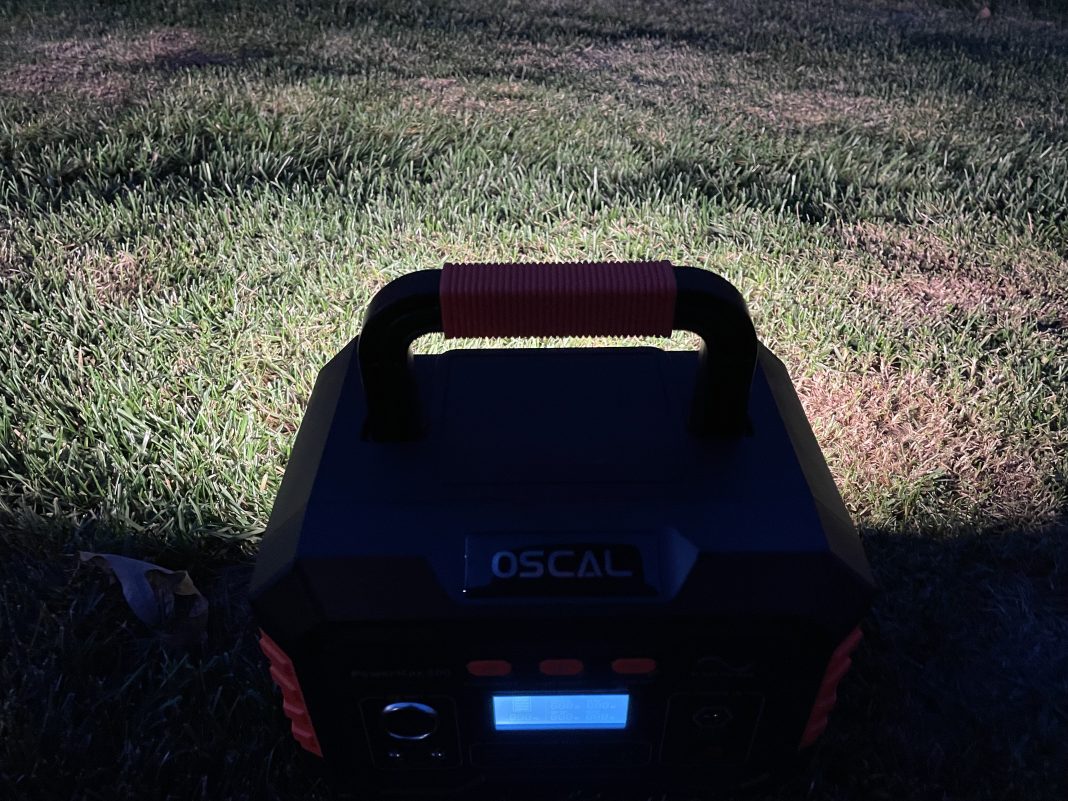 Oscal PowerMax 300 LED flashlight lighting up ground