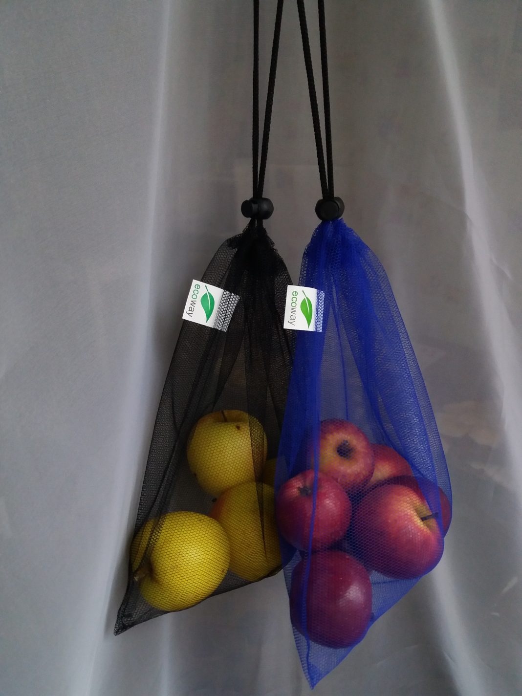 reusable produce bags holding fruit