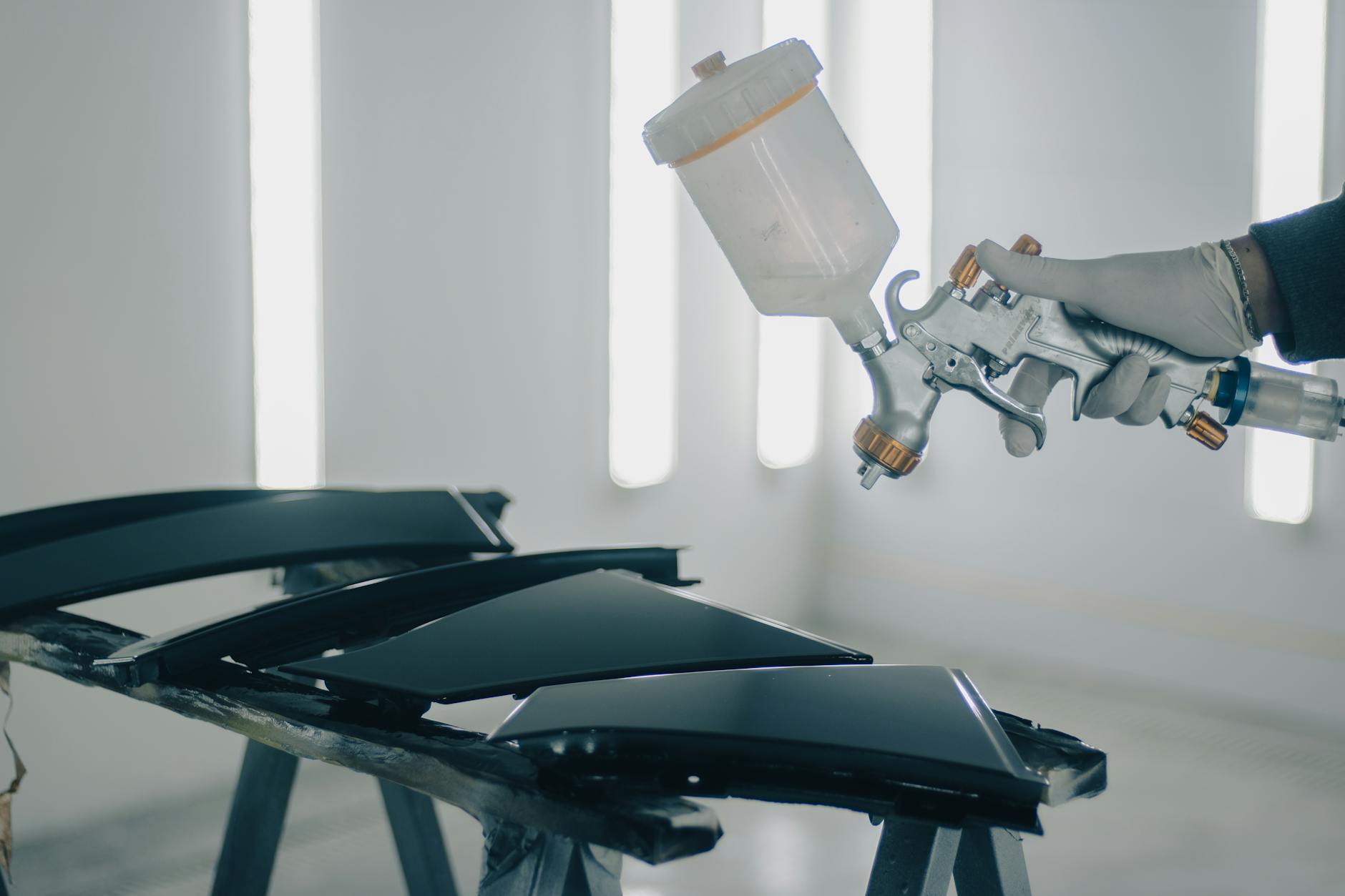 close up of man painting car details