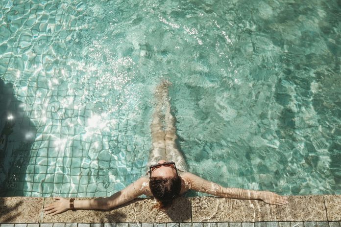 woman relaxing at the pool