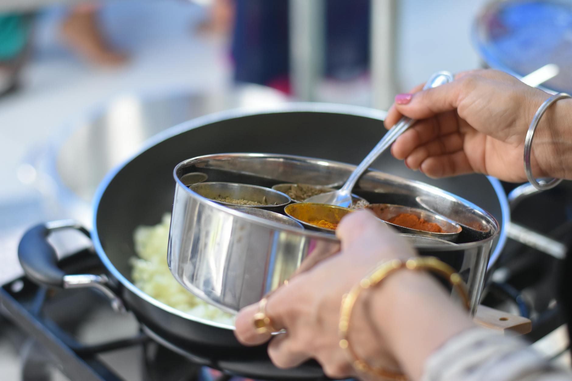 a woman cooking indian food