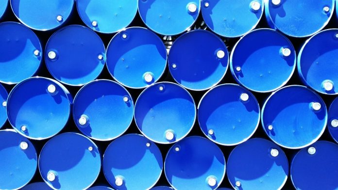 high angle photograph of blue metal barrels