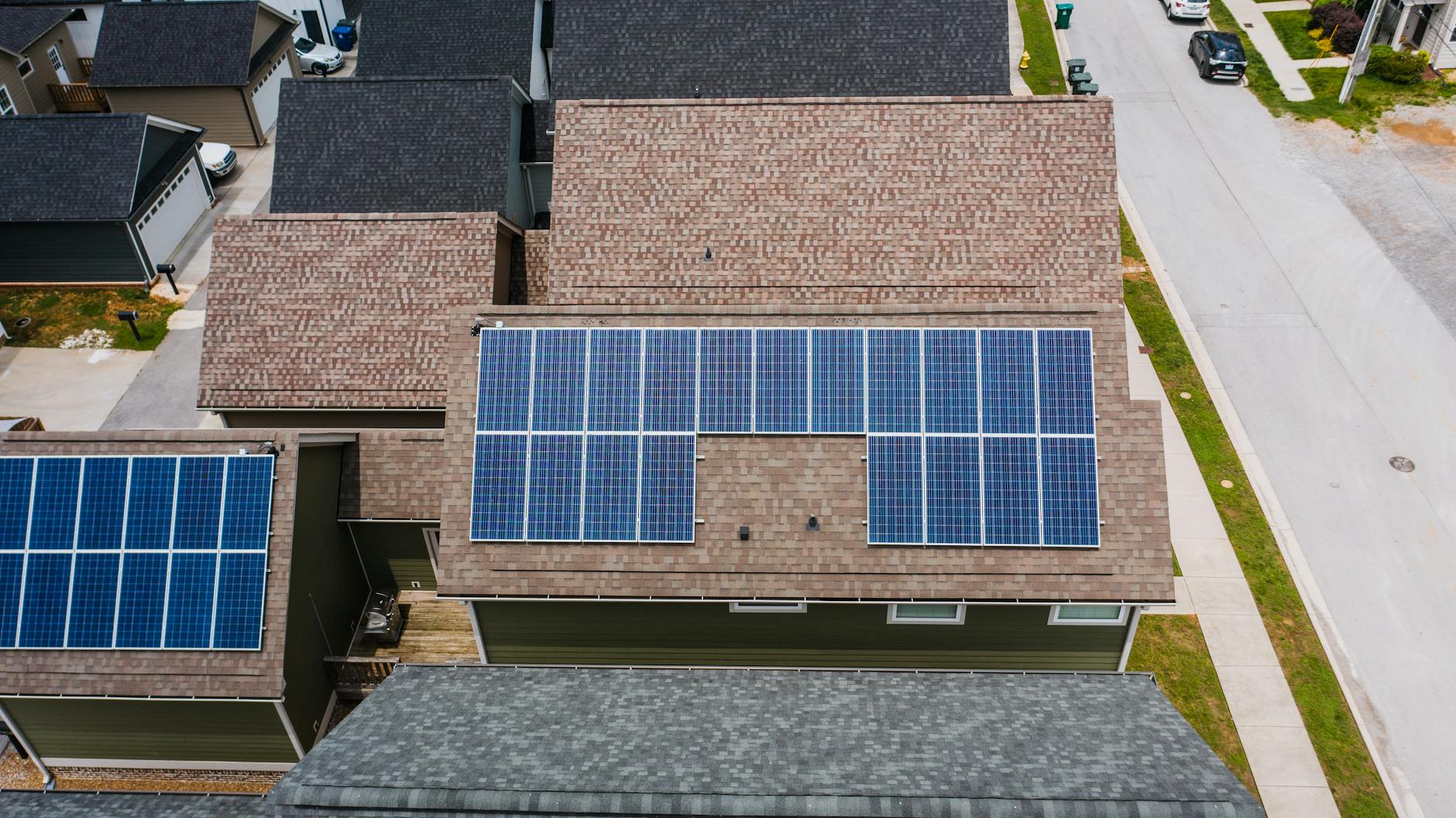 solar panels on tiled roofs of a house